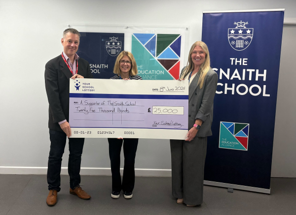Your School Lottery present a £25,000 winner's cheque Snaith School in Goole